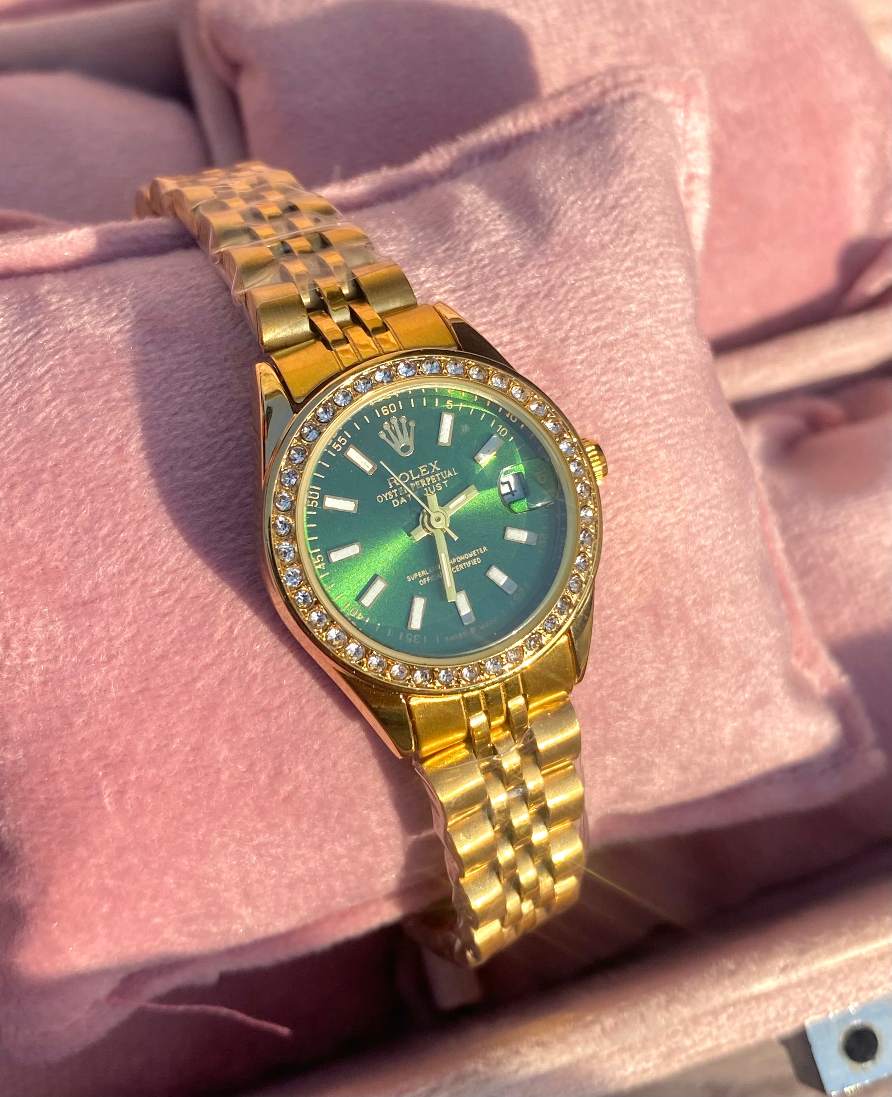 Emerald stone dial watch